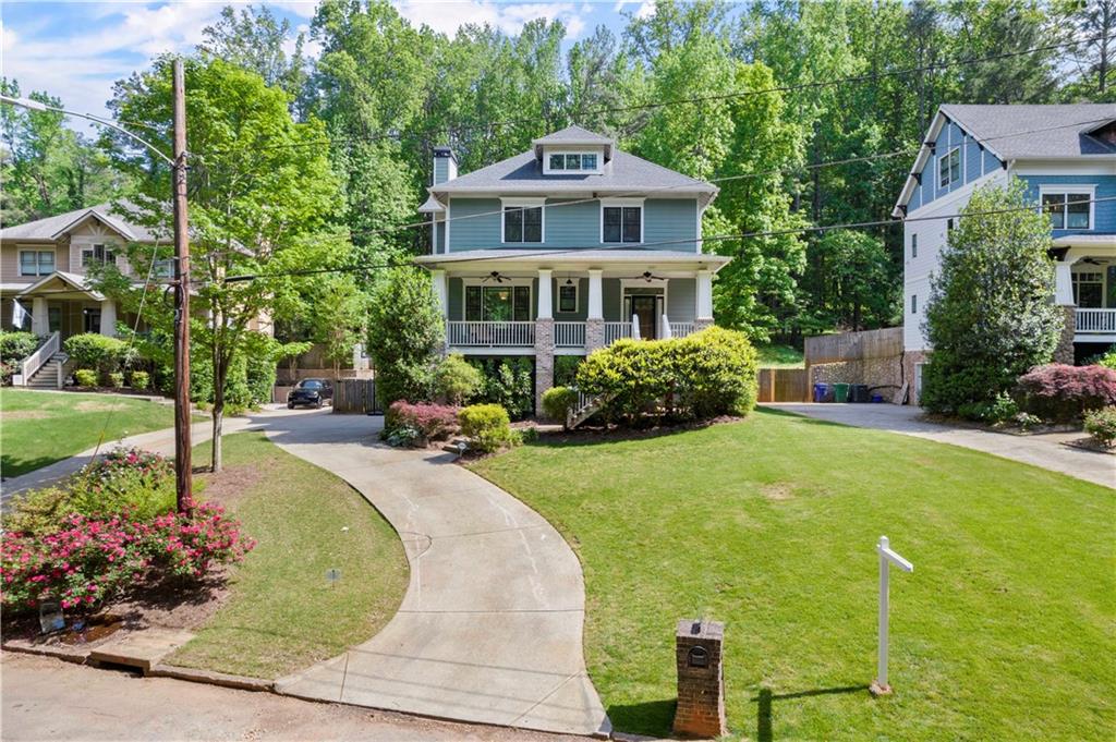 2597 Dusty Lane Decatur, GA 30032 - Photo 1 of 1 a front view of a house with a yard table and chairs
