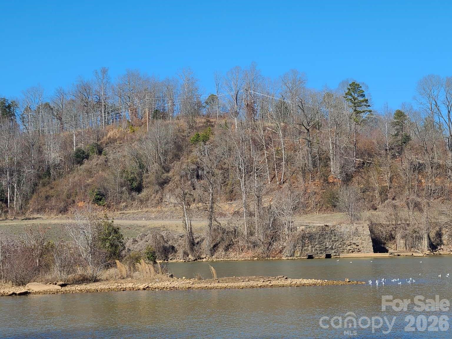 0 Powerhouse Road Granite Falls, NC 28630 - Photo 3 of 5 a view of a city street next to a yard