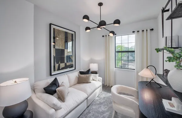 an empty room with windows and bathroom