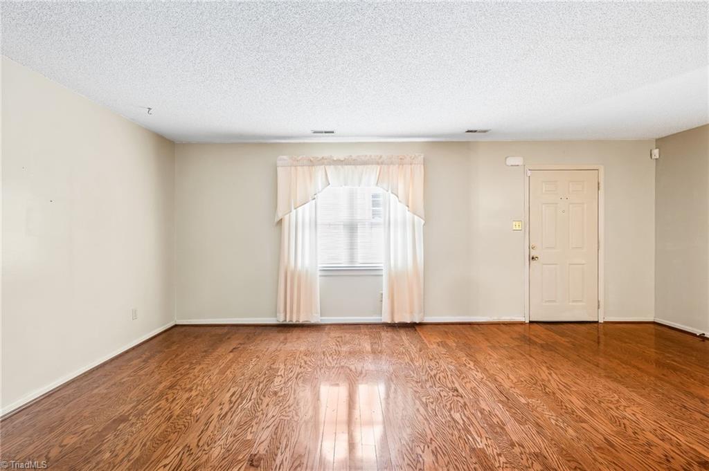 5747 Bramblegate Road, Unit A Greensboro, NC 27409 - Photo 5 of 19 Living room from hallway