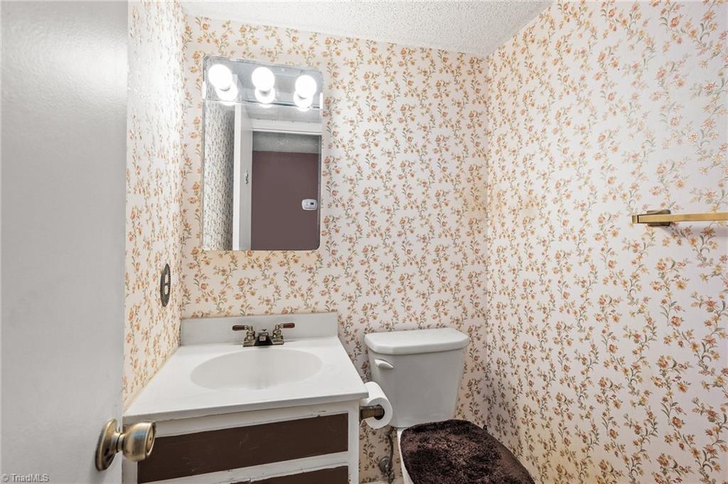 5747 Bramblegate Road, Unit A Greensboro, NC 27409 - Photo 6 of 19 Half bath on main