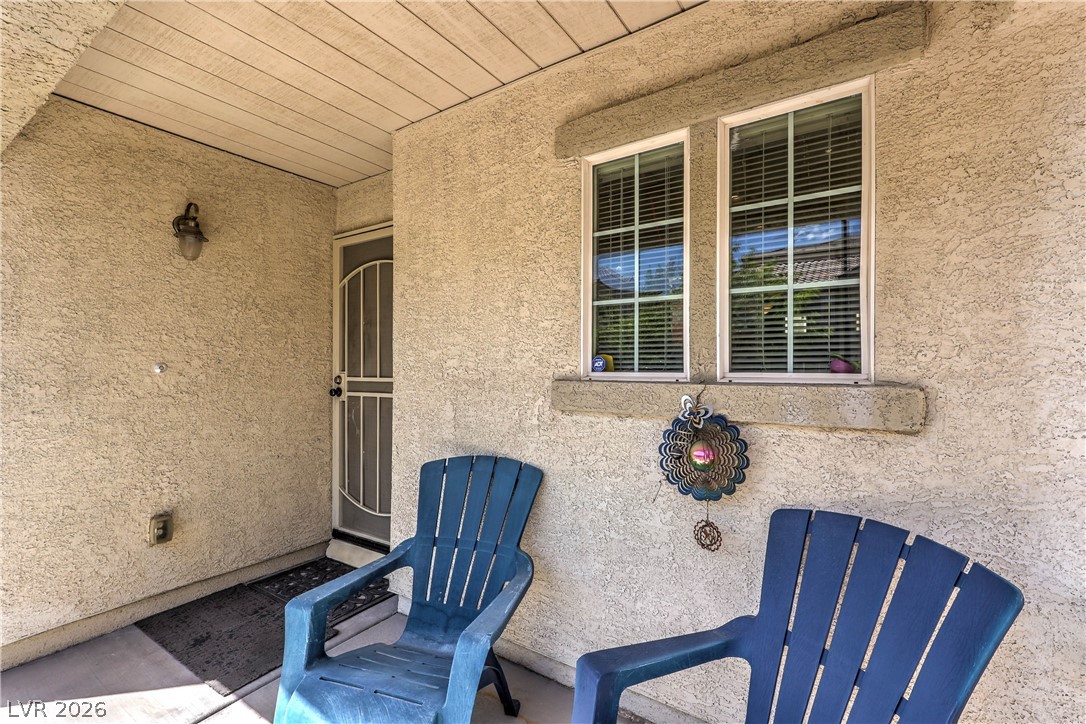 9068 West Alluring Avenue Las Vegas, NV 89149 - Photo 4 of 23 This inviting porch area offers a welcoming entry to the home.