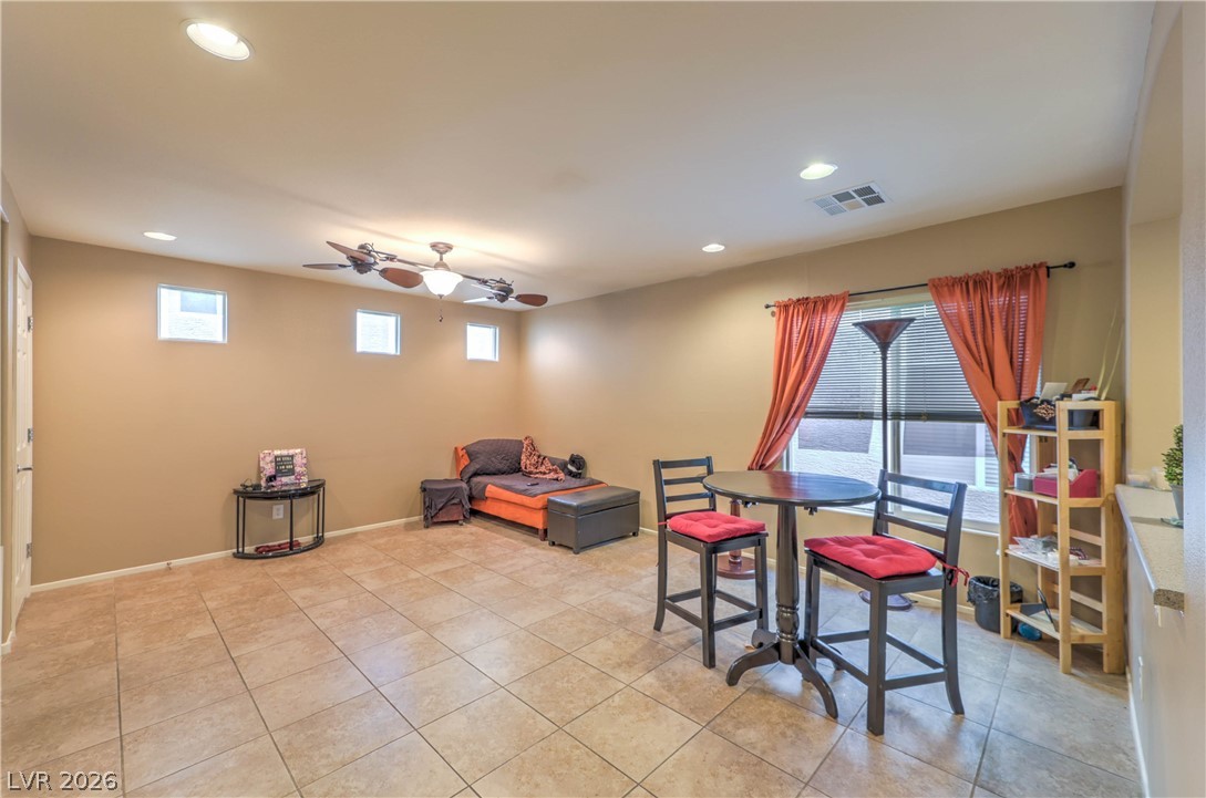 9068 West Alluring Avenue Las Vegas, NV 89149 - Photo 5 of 23 This versatile space features a bright window and tile flooring, perfect for various living arrangements.