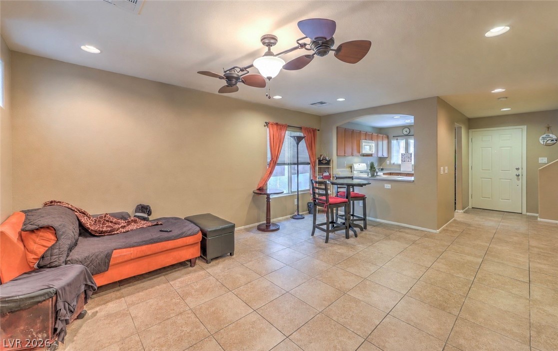 9068 West Alluring Avenue Las Vegas, NV 89149 - Photo 23 of 23 This living area features a convenient open floorplan with recessed lighting.