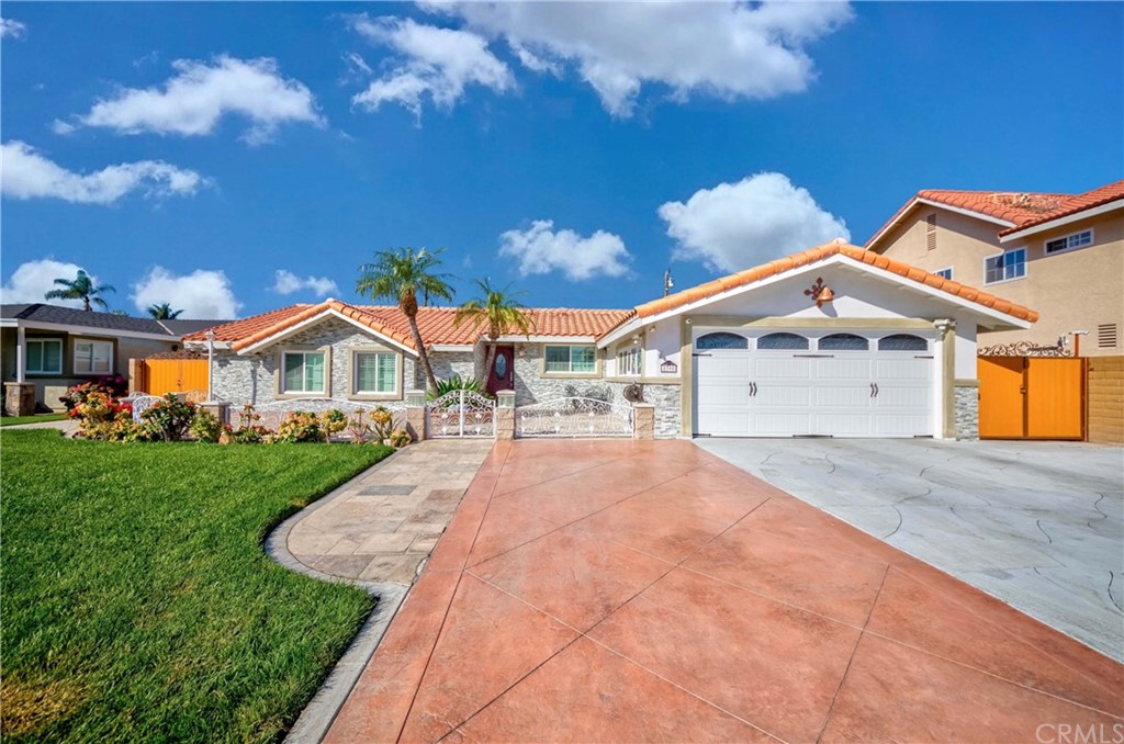 8395 Mars Drive Buena Park, CA 90620 - Photo 1 of 73 a front view of a house with yard