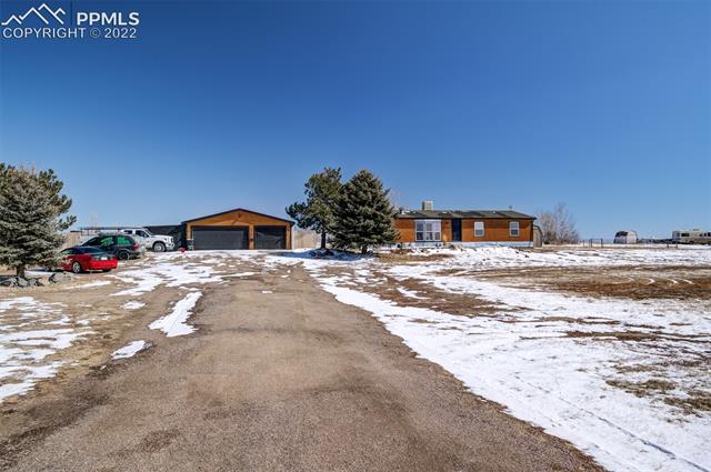 5705 Whipshaw Road Peyton, CO 80831 - Photo 5 of 34 Front of Home, Street View/End of Driveway