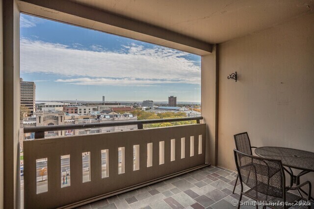 1 Gold Street, Unit 11E Hartford, CT 06103 - Photo 16 of 25 a view of a balcony with wooden chairs