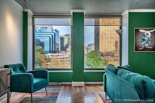 a living room with furniture and a large window