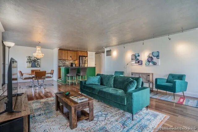 a living room with furniture and a fireplace