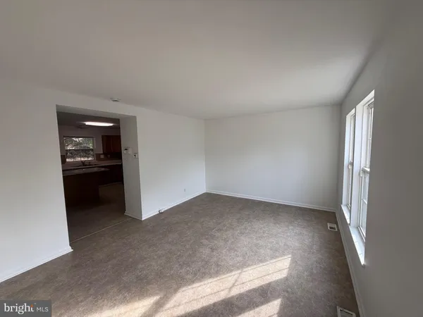 an empty room with kitchen