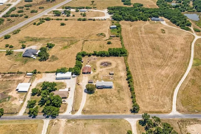 an aerial view of residential houses with outdoor space