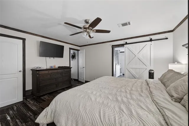 a large white kitchen with a large window