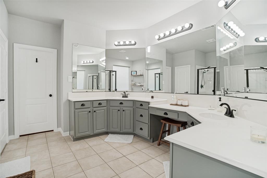 1612 Coventry Lane Allen, TX 75002 - Photo 12 of 39 Spacious bathroom featuring an L-shaped dual vanity with gray cabinetry, white countertops, and tile flooring