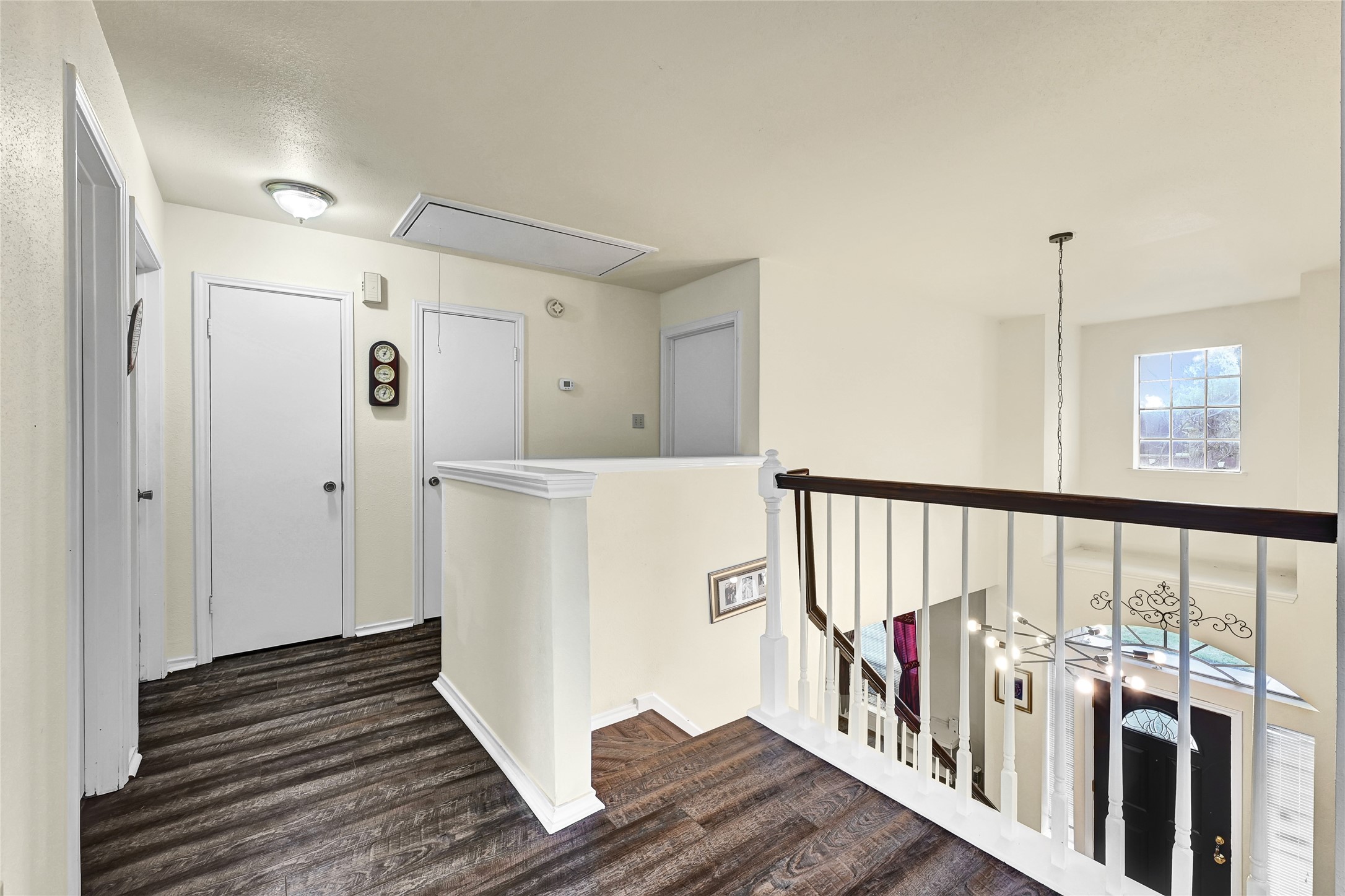 5910 Rolff Lane Houston, TX 77084 - Photo 11 of 50 Upper-level landing overlooking the main living space, adding openness and architectural interest.