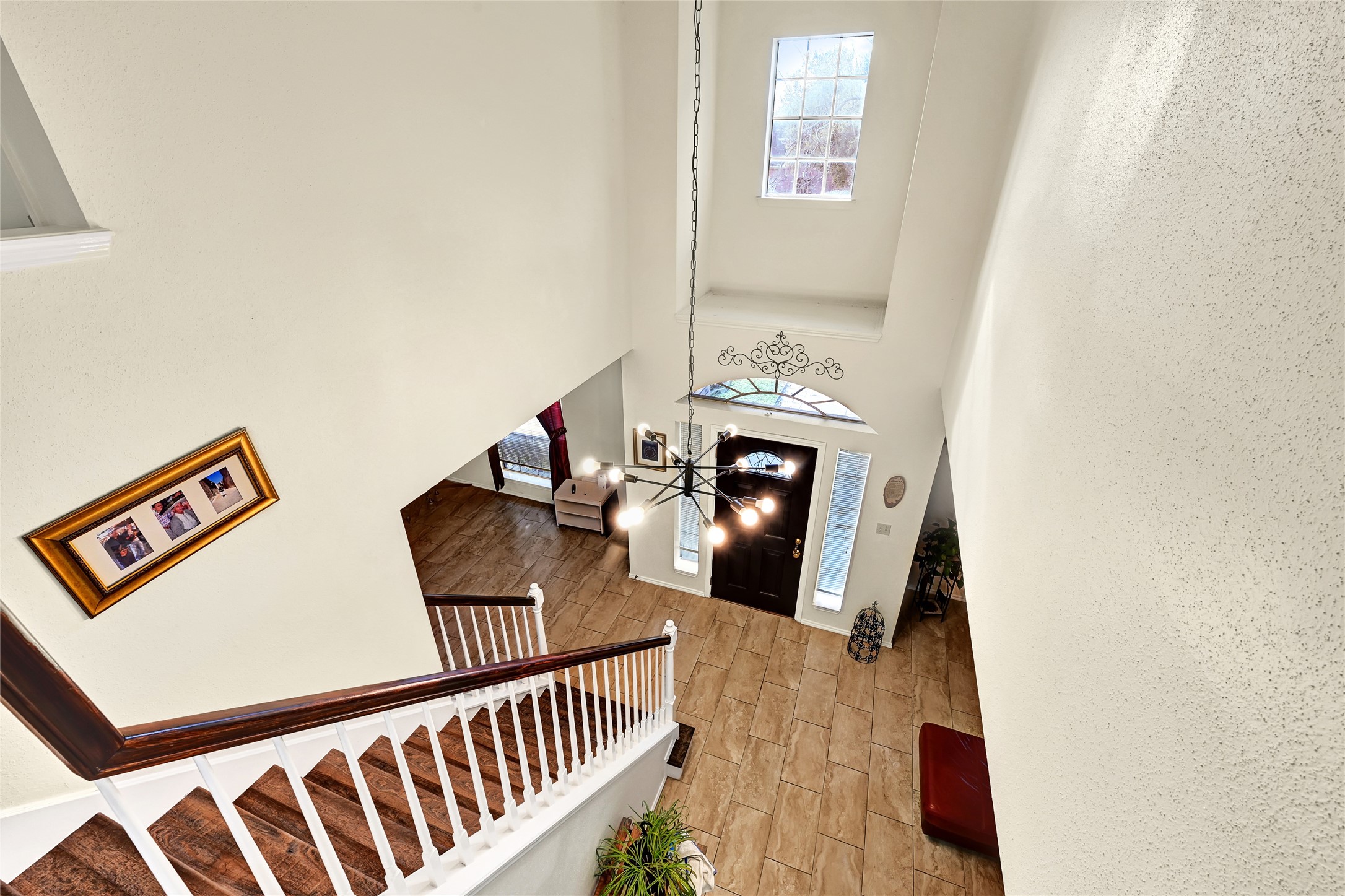 5910 Rolff Lane Houston, TX 77084 - Photo 12 of 50 Staircase and overlook creating a bright, open feel between levels.