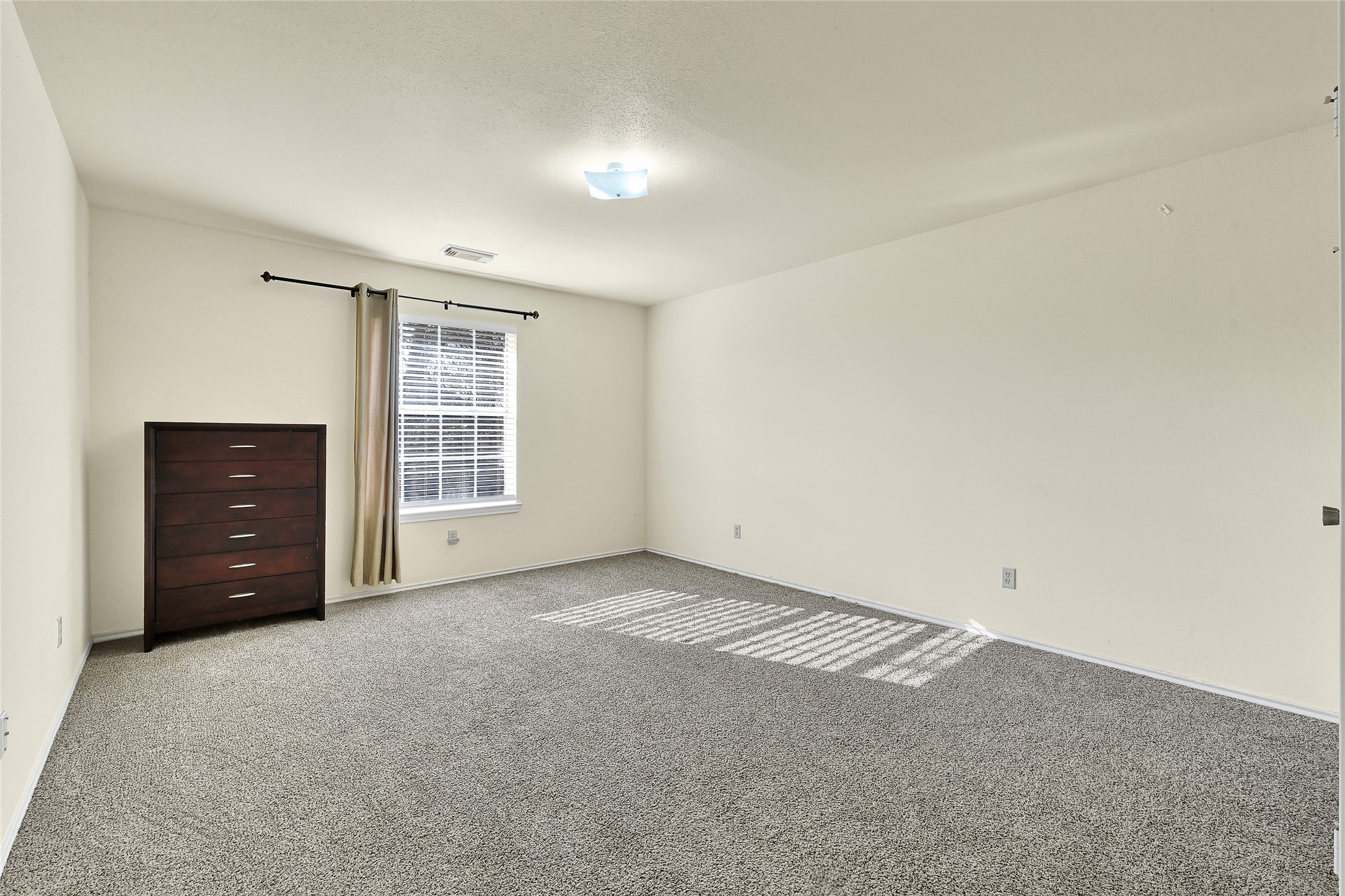 5910 Rolff Lane Houston, TX 77084 - Photo 17 of 50 Secondary bedroom offering natural light and a practical layout.