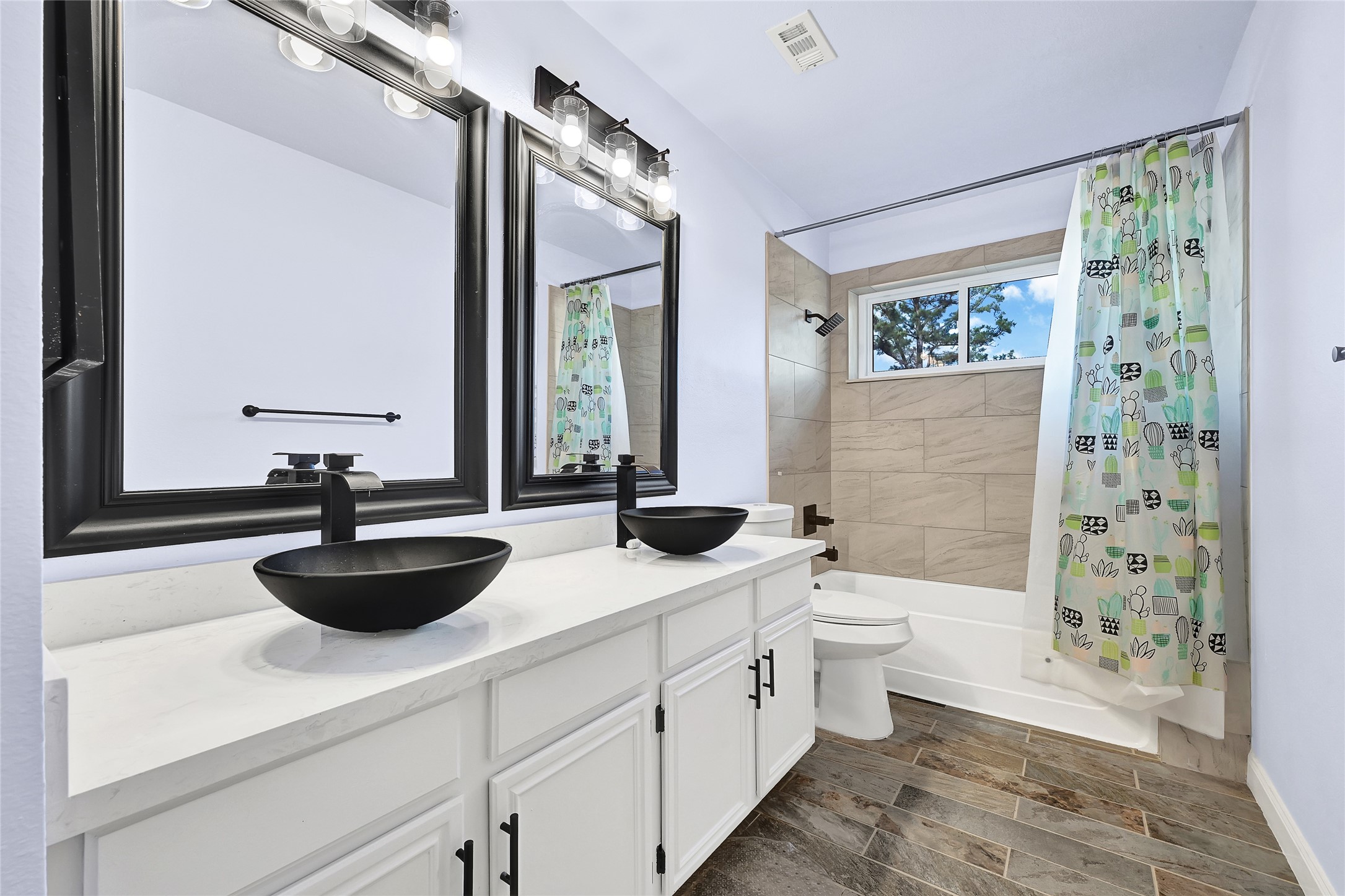 5910 Rolff Lane Houston, TX 77084 - Photo 20 of 50 Primary bathroom featuring dual vanities, modern fixtures, and generous counter space.