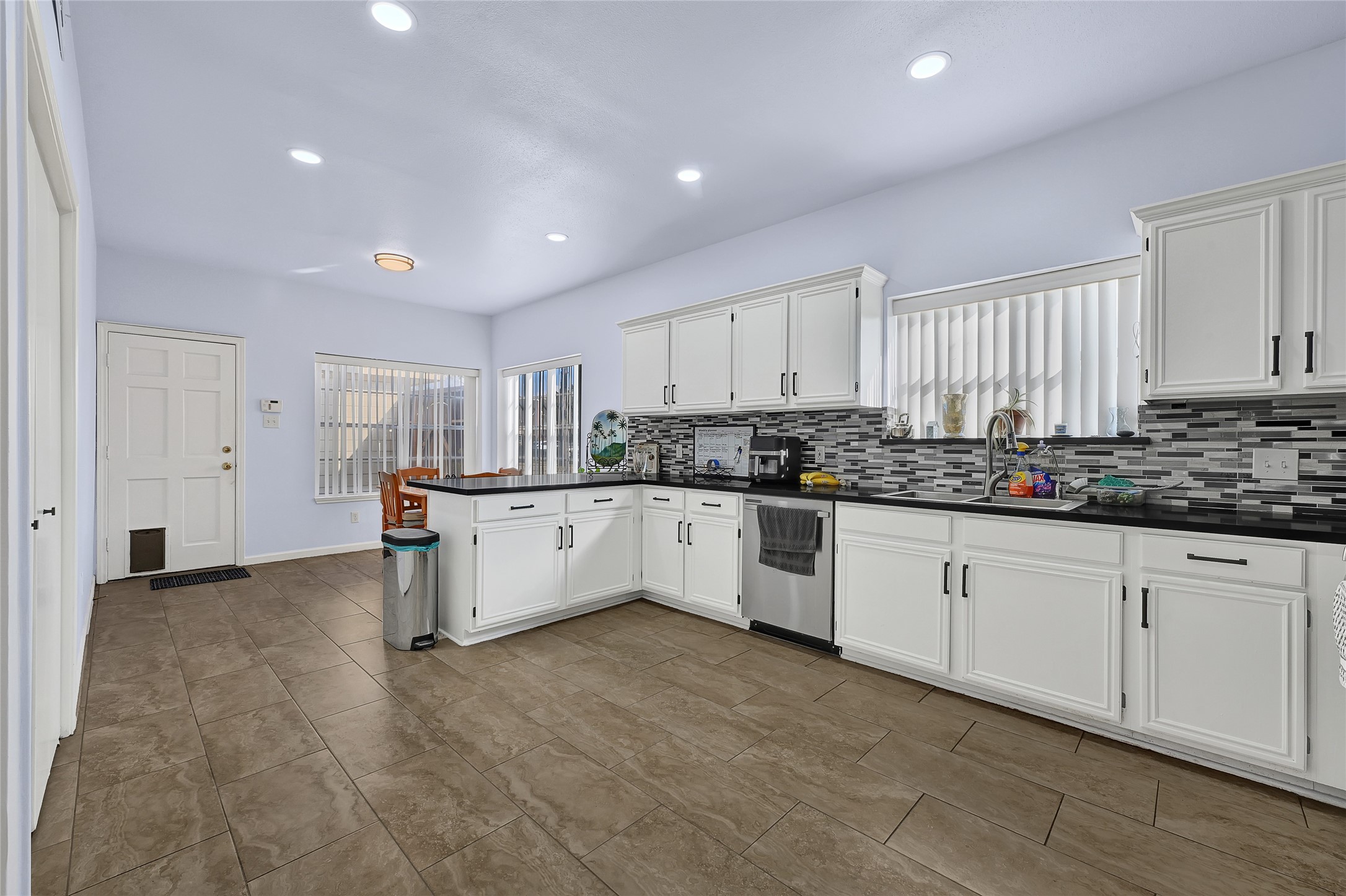 5910 Rolff Lane Houston, TX 77084 - Photo 22 of 50 Open kitchen with extensive cabinetry, modern finishes, and ample prep space.