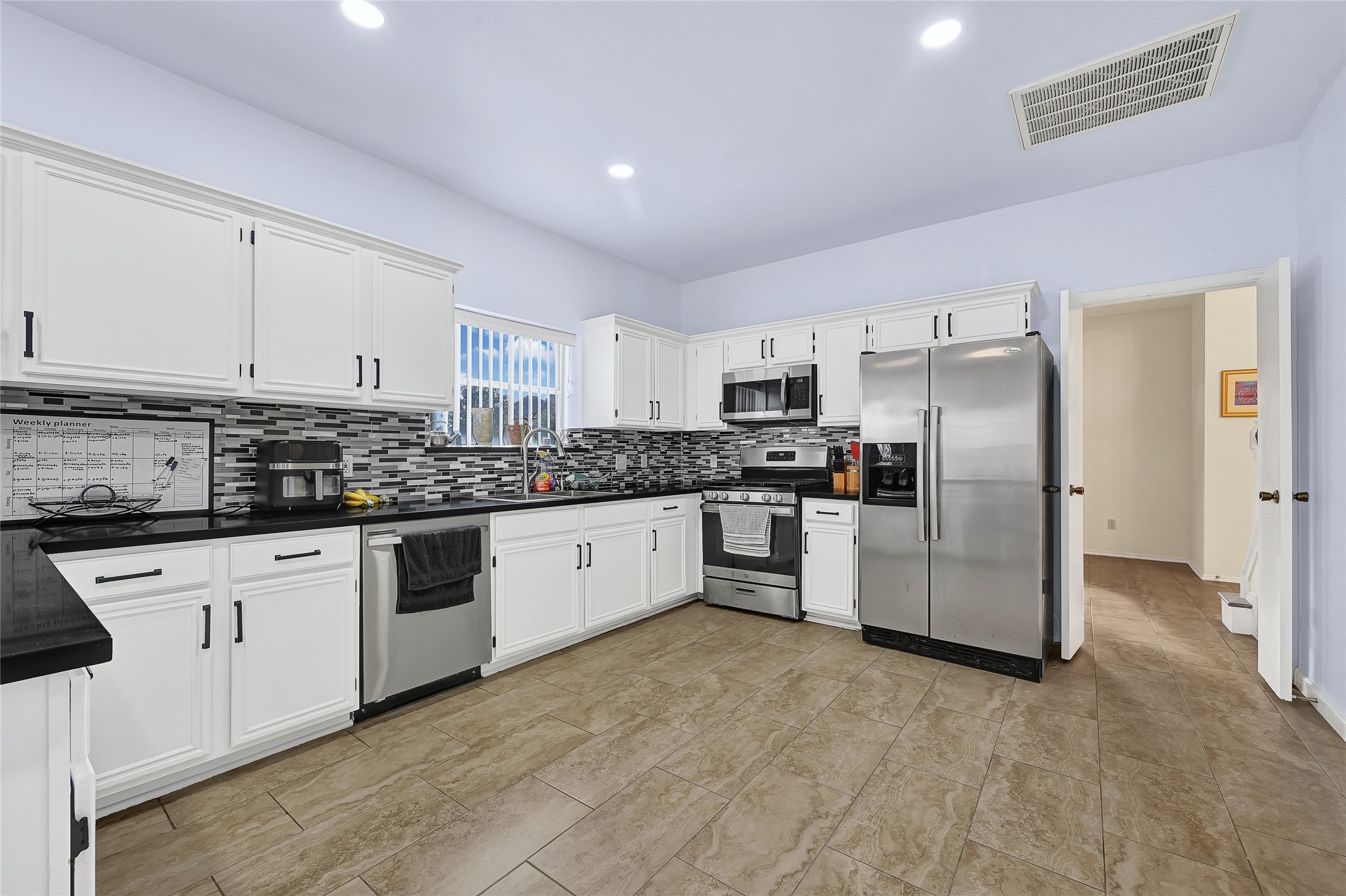 5910 Rolff Lane Houston, TX 77084 - Photo 23 of 50 Spacious kitchen with updated appliances and efficient workflow design.