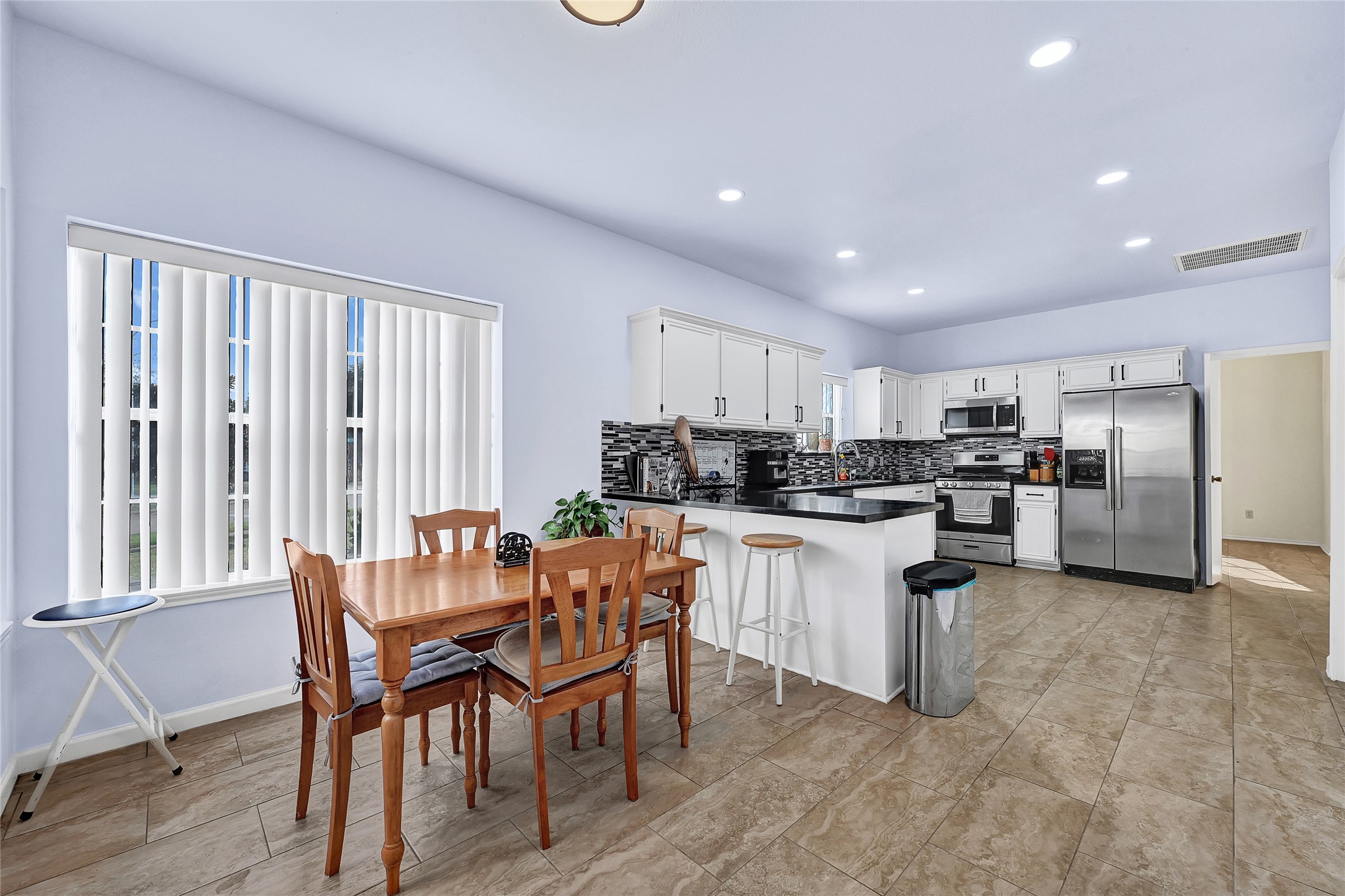 5910 Rolff Lane Houston, TX 77084 - Photo 28 of 50 Bright dining space with large windows and open-concept feel.