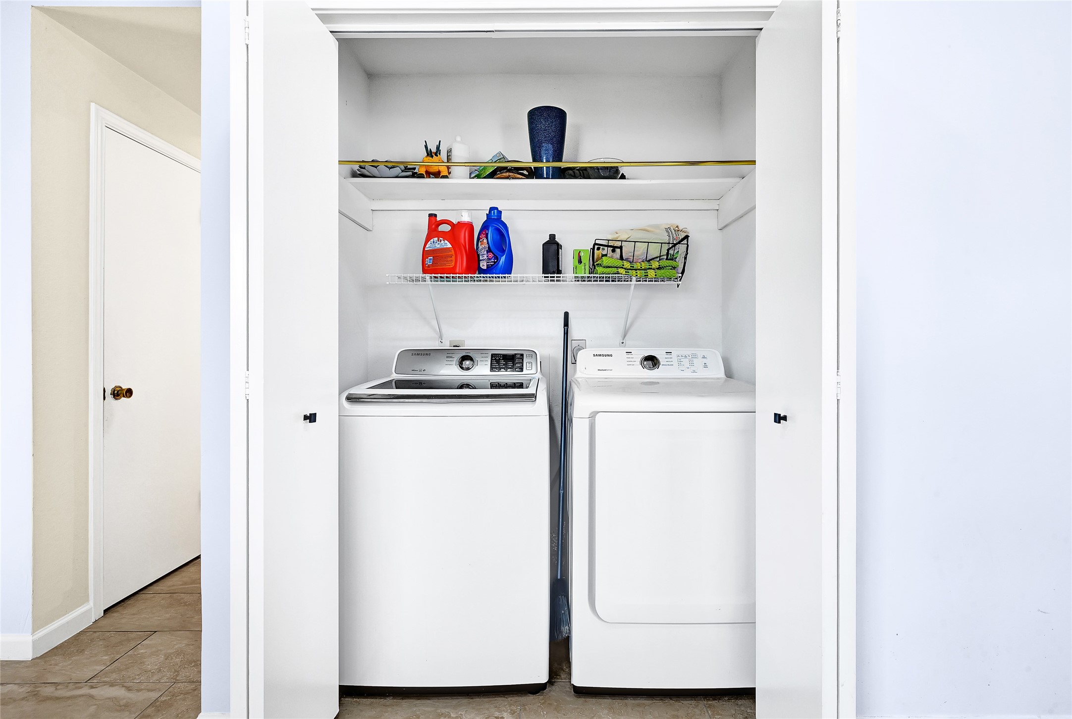5910 Rolff Lane Houston, TX 77084 - Photo 29 of 50 Laundry area with built-in shelving and convenient workspace.