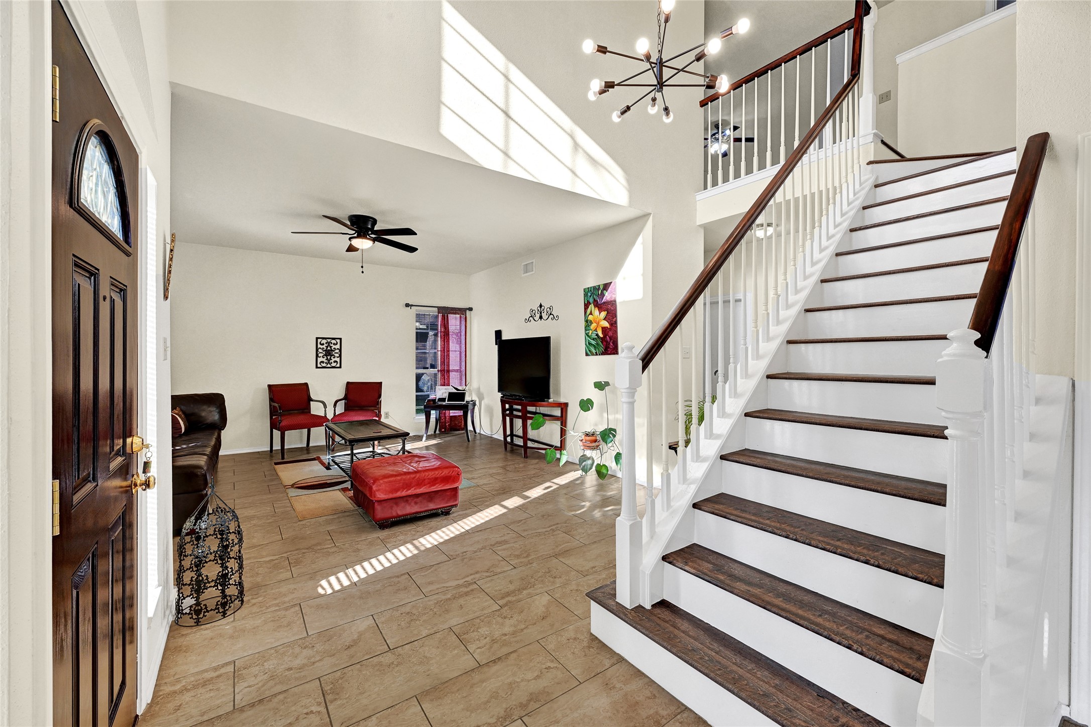 5910 Rolff Lane Houston, TX 77084 - Photo 34 of 50 Staircase feature with modern railing and strong architectural presence.