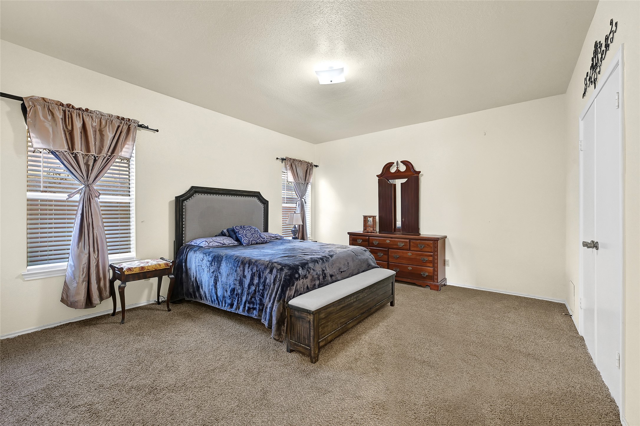 5910 Rolff Lane Houston, TX 77084 - Photo 39 of 50 Large primary bedroom with generous space, natural light, and a relaxing atmosphere.