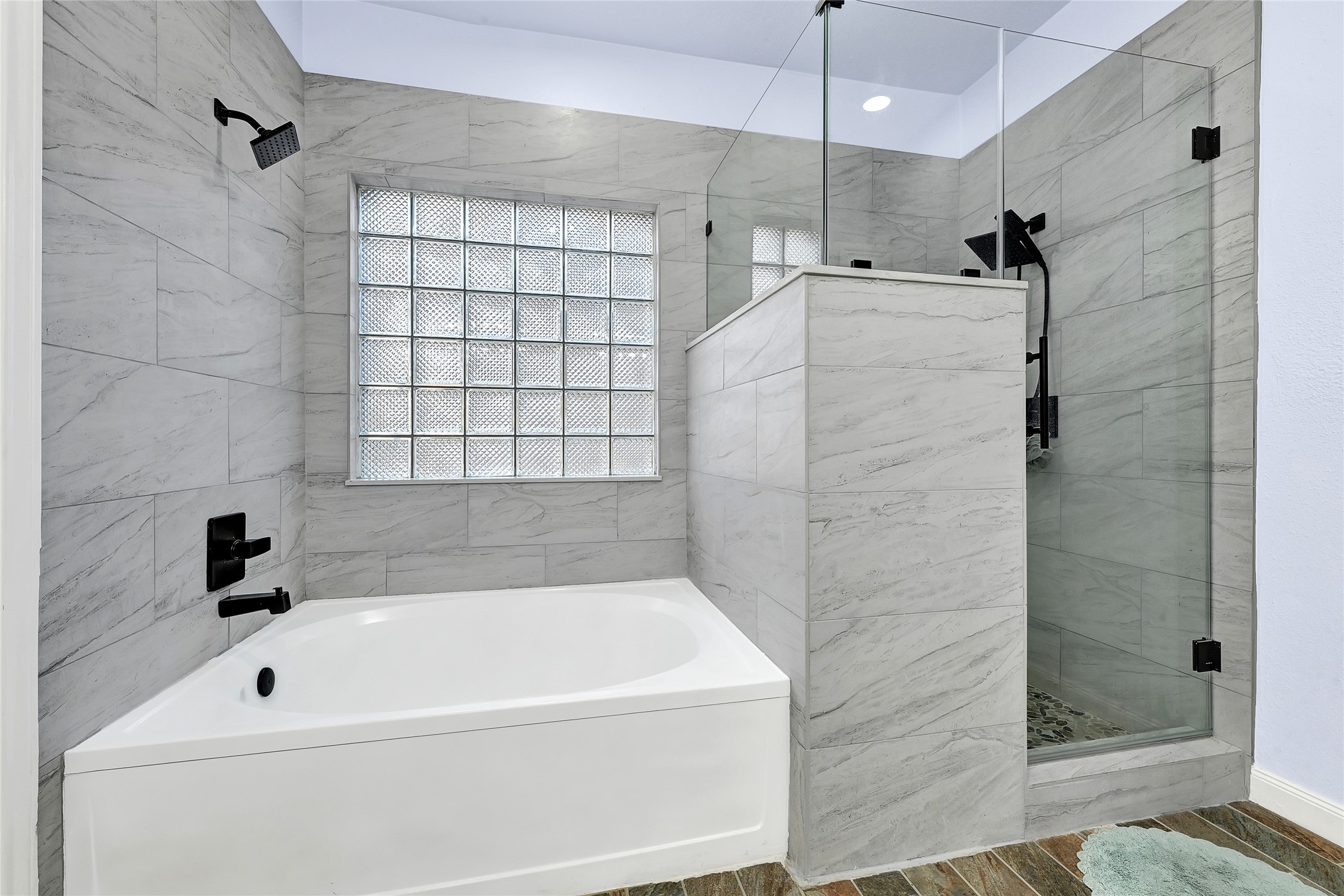 5910 Rolff Lane Houston, TX 77084 - Photo 42 of 50 Updated bath with modern tilework and bright, clean finishes.