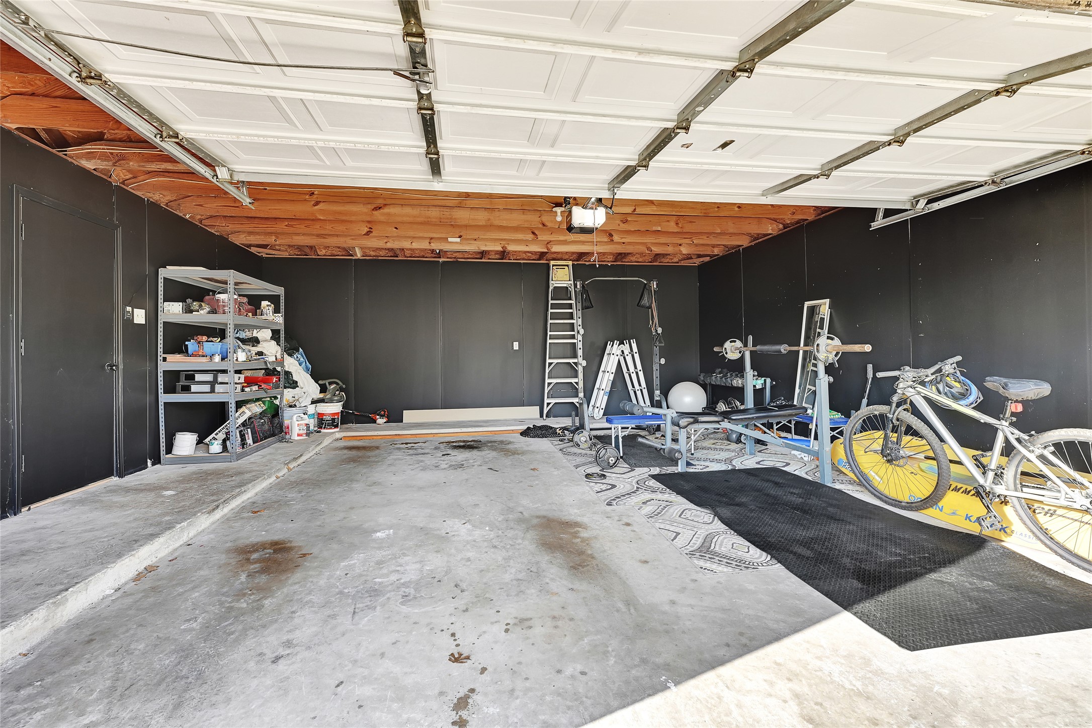 5910 Rolff Lane Houston, TX 77084 - Photo 49 of 50 Spacious garage with room for parking, storage, or workspace.