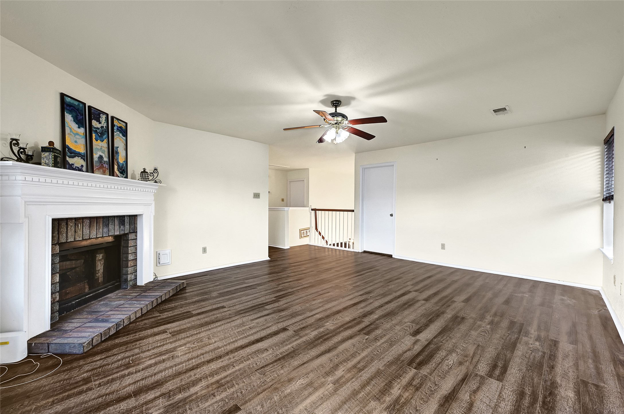 5910 Rolff Lane Houston, TX 77084 - Photo 8 of 50 Expansive living room with wood flooring, abundant natural light, and a comfortable layout.