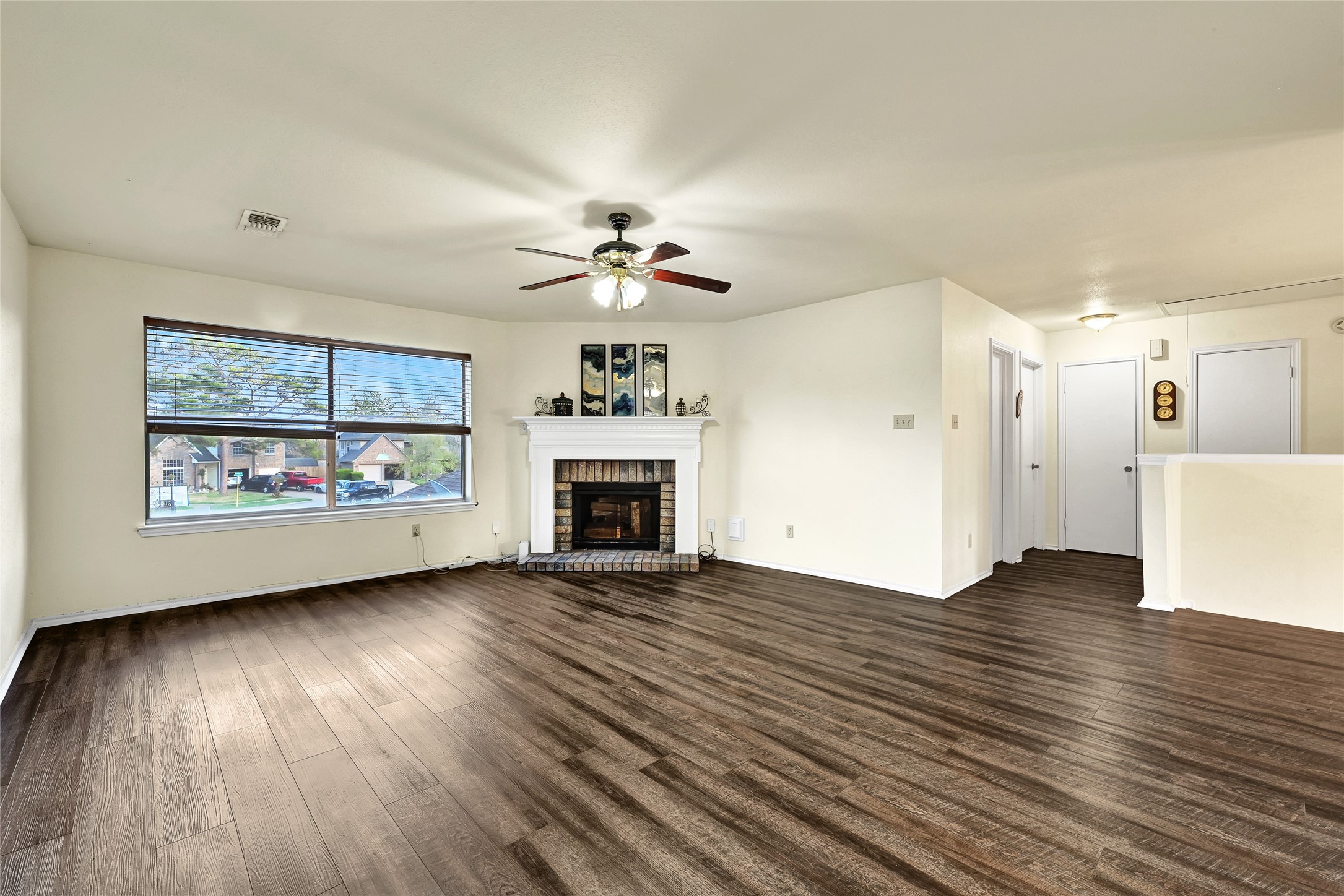 5910 Rolff Lane Houston, TX 77084 - Photo 9 of 50 Large living space with fireplace focal point and seamless connection to surrounding areas.