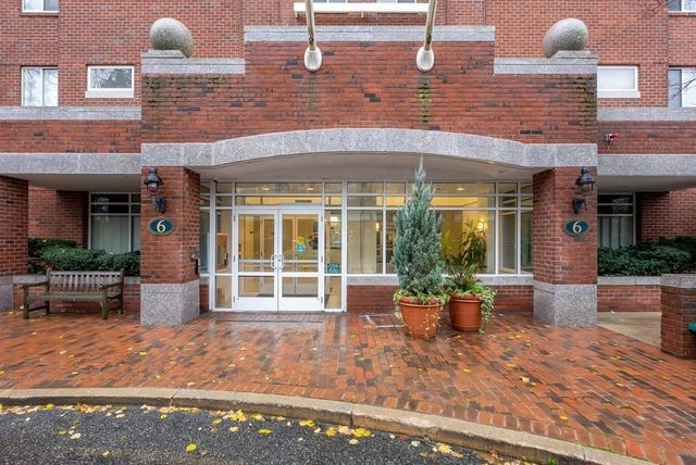 a front view of a house with outdoor seating