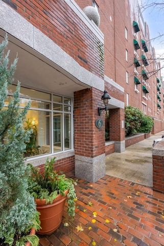 a front view of a house with outdoor seating and plants