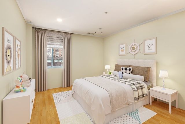 a bedroom with a bed and a couch