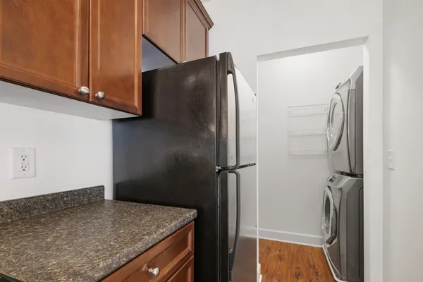 a kitchen with metallic refrigerator freezer and a dishwasher