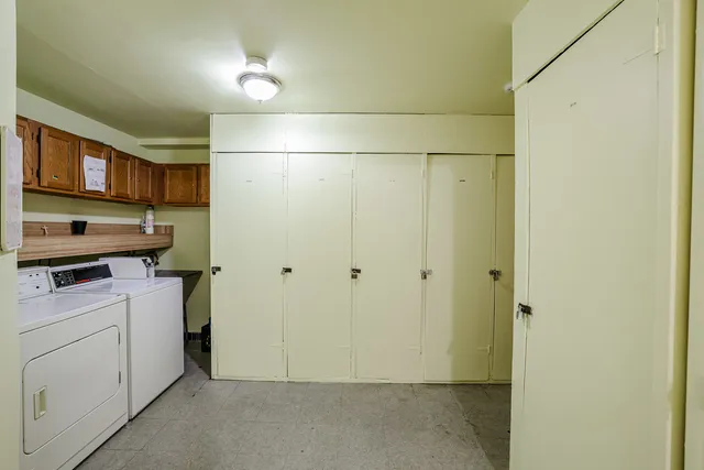 a view of a storage & utility room with washer and dryer