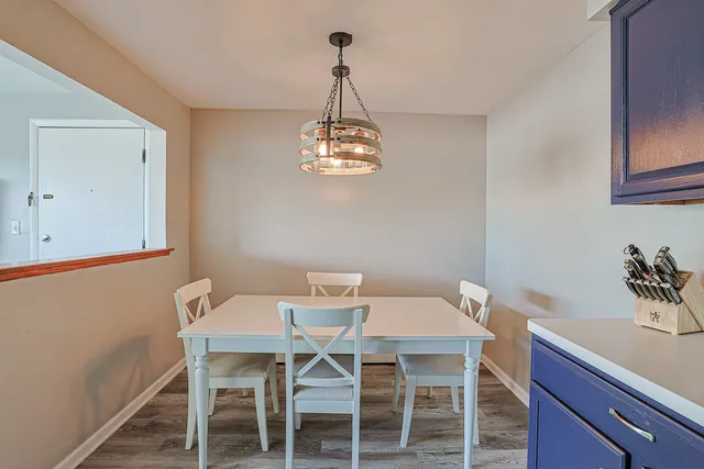 a dining room with a table and chairs