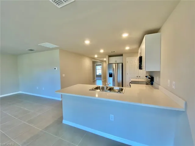 a lobby with a sink and mirror