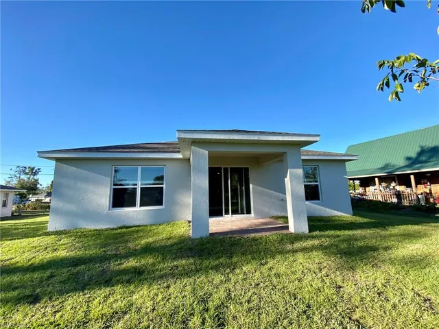 a view of a back yard from a room