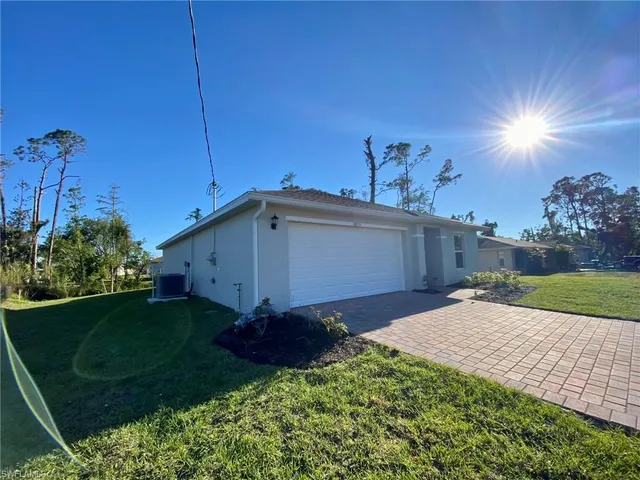 a view of a backyard of the house