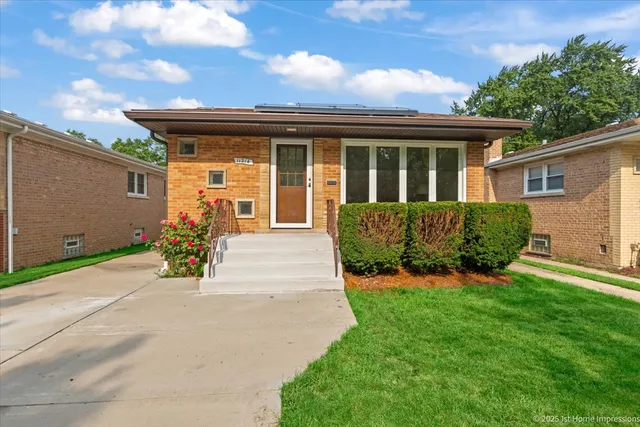 a kitchen with a stove a sink cabinetry and a dining table