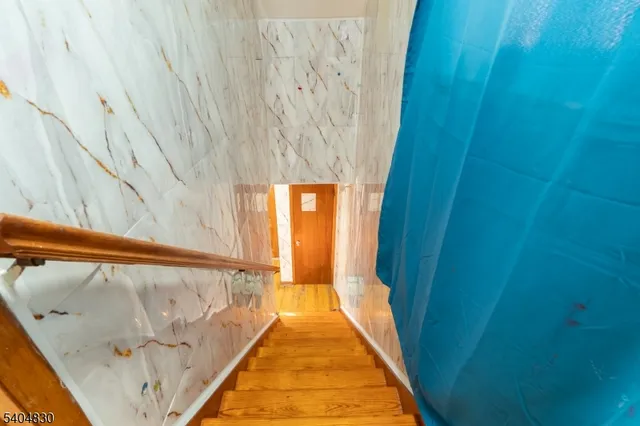 a bathroom with a bathtub and window