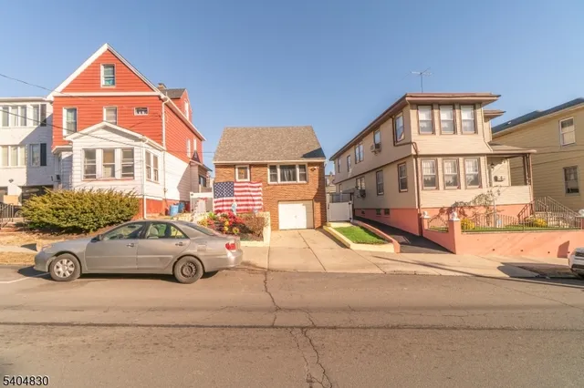 a car parked in front of a house