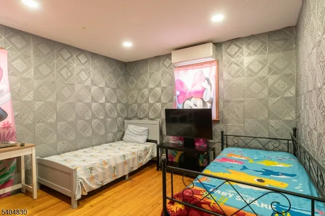 a room with pool table and a flat screen tv