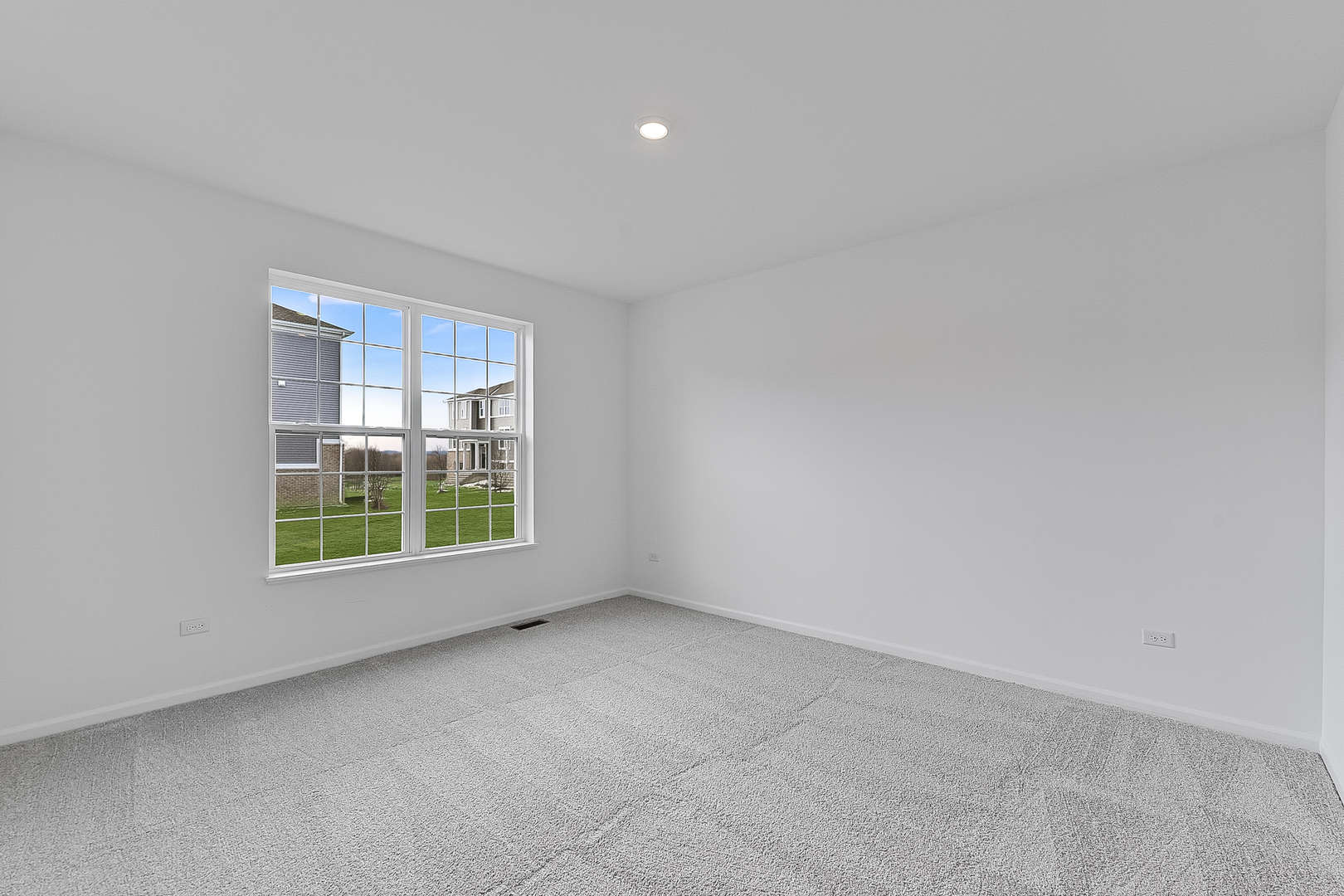 14905 South Mccarthy Circle Plainfield, IL 60544 - Photo 8 of 13 an empty room with windows