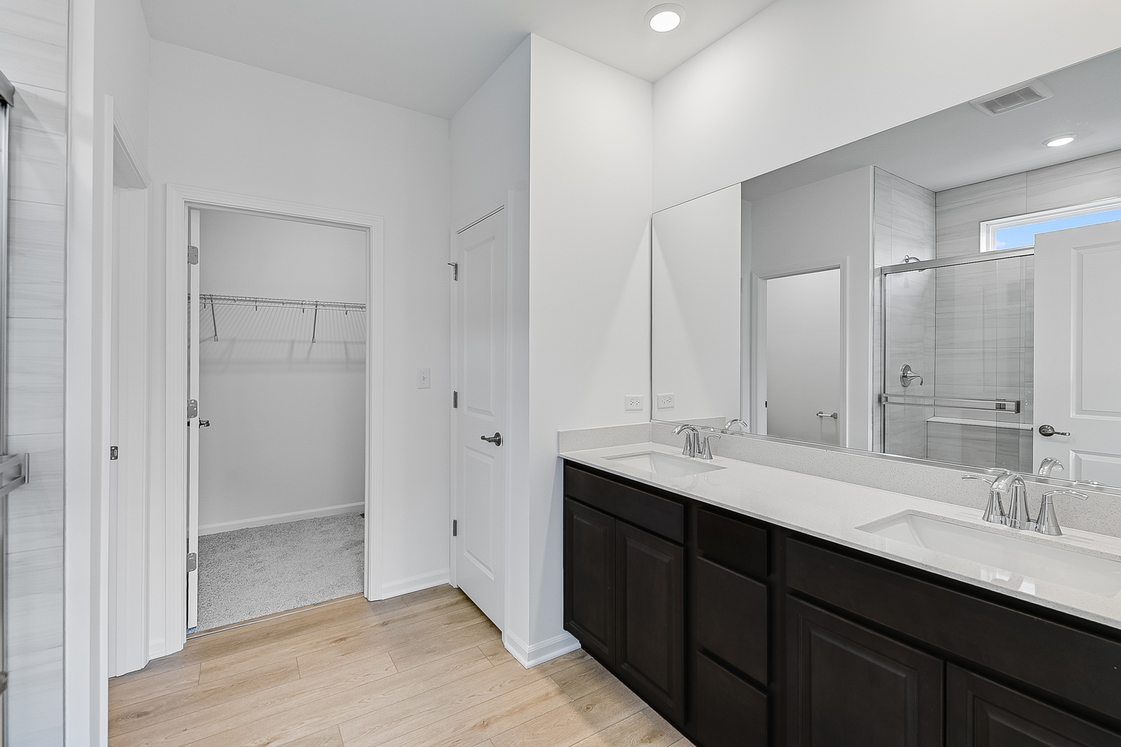14905 South Mccarthy Circle Plainfield, IL 60544 - Photo 9 of 13 a bathroom with double sink and a mirror