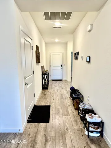 a bathroom with a double vanity sink toilet and shower