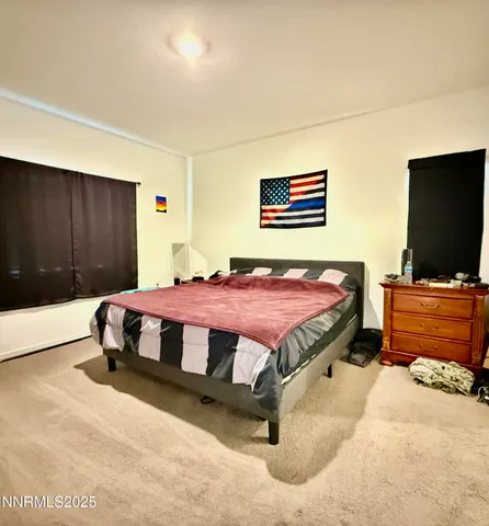 a bedroom with a bed and a walk in closet