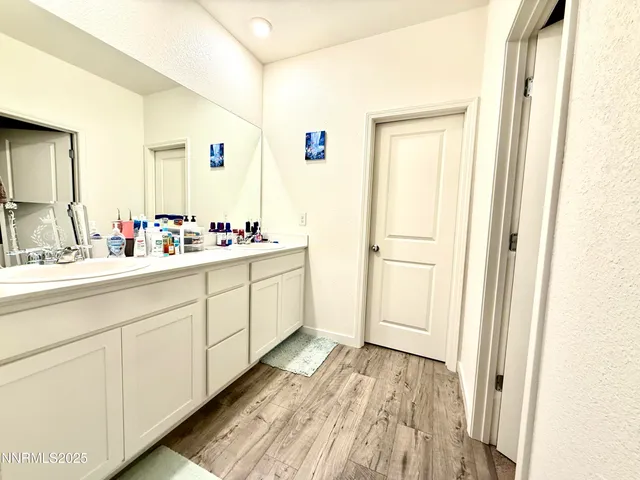 a livingroom with workspace and a couch