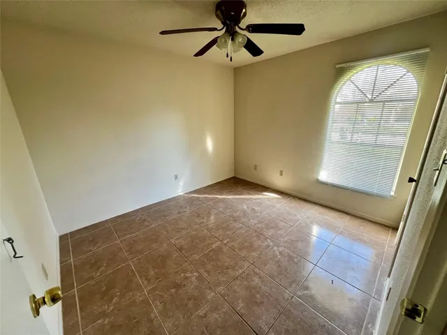 a view of an empty room and a window